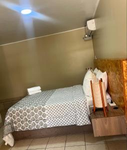 Cama ou camas em um quarto em Hotel El Huacachinero