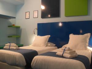 Posteľ alebo postele v izbe v ubytovaní Correra 241 Lifestyle Hotel