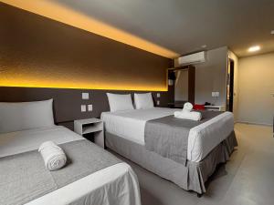 Postel nebo postele na pokoji v ubytování Saint Patrick Grand Hotel