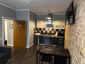 Kuchyň nebo kuchyňský kout v ubytování ApartHotel Riga