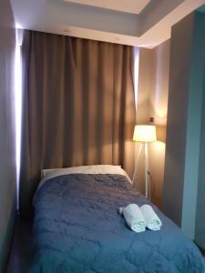 Hotel Driti New Bazaar房間的床