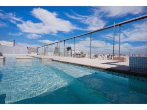 a swimming pool on the roof of a building at Recoleta - Elite 13th floor apt with rooftop pool in Buenos Aires