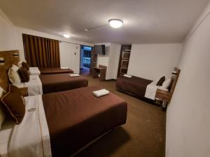Postel nebo postele na pokoji v ubytování San Francisco Pardo Hotel