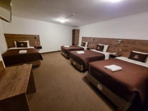 Postel nebo postele na pokoji v ubytování San Francisco Pardo Hotel