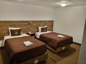 Postel nebo postele na pokoji v ubytování San Francisco Pardo Hotel