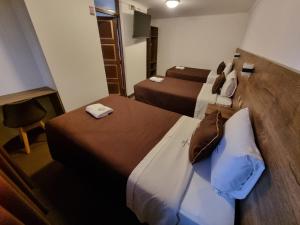 Postel nebo postele na pokoji v ubytování San Francisco Pardo Hotel