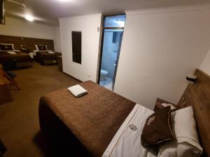Postel nebo postele na pokoji v ubytování San Francisco Pardo Hotel
