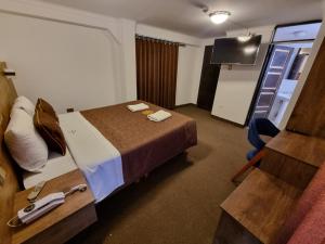 Postel nebo postele na pokoji v ubytování San Francisco Pardo Hotel