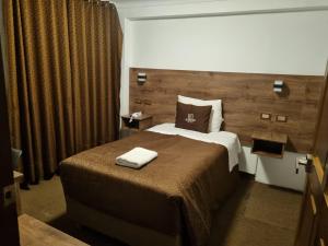 Postel nebo postele na pokoji v ubytování San Francisco Pardo Hotel