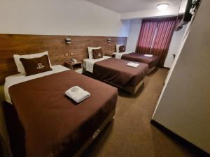 Postel nebo postele na pokoji v ubytování San Francisco Pardo Hotel