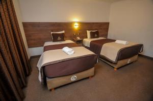 Postel nebo postele na pokoji v ubytování San Francisco Pardo Hotel