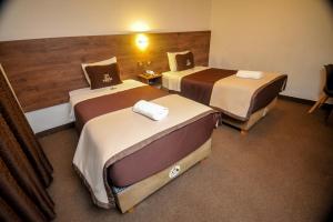 Postel nebo postele na pokoji v ubytování San Francisco Pardo Hotel