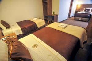 Postel nebo postele na pokoji v ubytování San Francisco Pardo Hotel