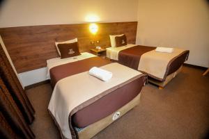 Postel nebo postele na pokoji v ubytování San Francisco Pardo Hotel