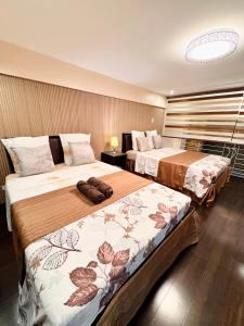 Postel nebo postele na pokoji v ubytování Super Cebu Loft