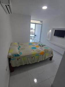 Postel nebo postele na pokoji v ubytování Hostal Las Orquideas 2