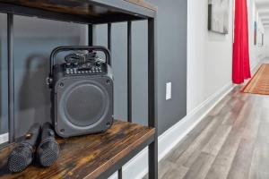 a speaker sitting on a table in a room at Chic 5BR Oasis in NOLA's Heart in New Orleans