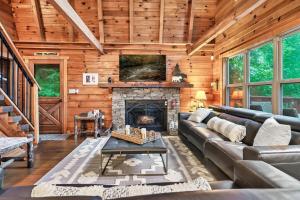 a living room with a couch and a fireplace at Mountain views,King Beds, Pet Friendly, Private retreat in Pigeon Forge