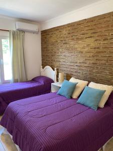 Ein Bett oder Betten in einem Zimmer der Unterkunft Complejo Pampa