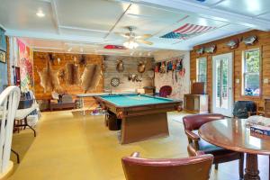 a room with a pool table and ping pong ball at Tennessee Farm Vacation Rental with Game Room! in Gadsden
