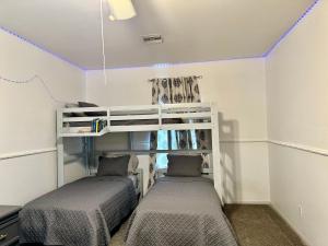 two bunk beds in a room with purple ceilings at Casa Linda in Desert Hot Springs +39 photos