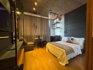 Postel nebo postele na pokoji v ubytování E-Compartilhe Biopark, edifício inteligente | Toledo + 37 fotografií