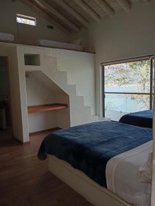 Postel nebo postele na pokoji v ubytování La Casa del Lago