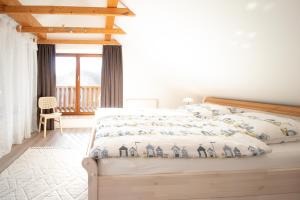 Ένα ή περισσότερα κρεβάτια σε δωμάτιο στο Ferienhaus LandMeer