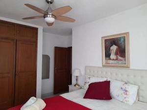 a bedroom with a bed with a ceiling fan at Modern apartment in Vilamoura with shared pool in Vilamoura +9 photos