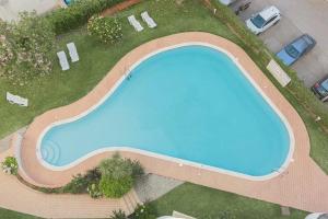 an overhead view of a swimming pool in a yard at Modern apartment in Vilamoura with shared pool in Vilamoura