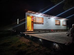 a house at night with lights on it at Buena vista, espacio natural. in Ráquira +26 photos