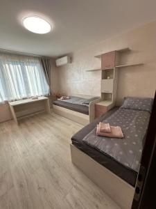 Postel nebo postele na pokoji v ubytování В къщи