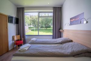 Postel nebo postele na pokoji v ubytování Hotel Eskifjörður