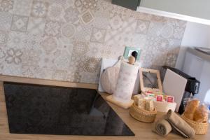 a toy kitchen with a counter with baskets and a shelf at Le Floreali - Casa Salvia in Bolsena