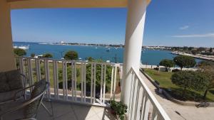 a balcony with a view of the water at Bella Vista Superior in Umag