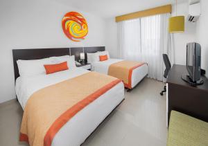 Postel nebo postele na pokoji v ubytování Hotel México Plaza Irapuato