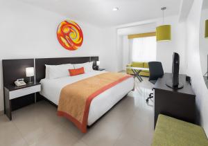 Postel nebo postele na pokoji v ubytování Hotel México Plaza Irapuato