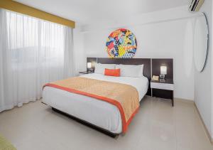 Postel nebo postele na pokoji v ubytování Hotel México Plaza Irapuato
