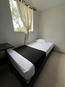 Voodi või voodid majutusasutuse HOTEl OTUN PLAZA PEREIRA toas