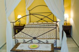a bedroom with a bed with a plate on it at Hostal Sixto in Rota