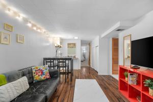 a living room with a couch and a table at Green Lake Zen Garden Basement in Seattle