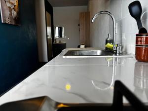 a kitchen counter top with a sink and a sink at Hotel Hostal Dulce Hogar in Tuxpan +7 photos