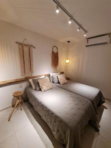 a bedroom with two beds in a room at CASA SALGA - MILAGRES - 3 mins a pé da praia da Capela in São Miguel dos Milagres +74 photos