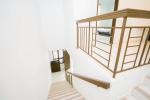 Ένα ή περισσότερα κρεβάτια σε δωμάτιο στο Homestay Budget KLIA