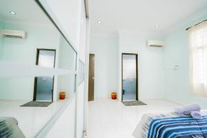 Ένα ή περισσότερα κρεβάτια σε δωμάτιο στο Homestay Budget KLIA +22 φωτογραφίες