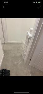 a bathroom with a toilet in the corner of a room at Uxbridge London Sober stay in shared house with Free St parking 5pm to 9am in Uxbridge