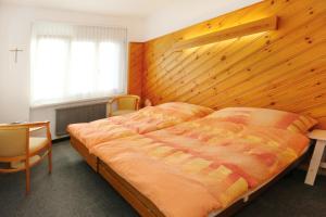 Voodi või voodid majutusasutuse Allegro Alpin Lodge toas