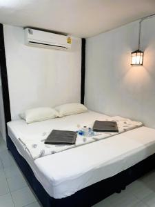 Postel nebo postele na pokoji v ubytování Tuk Tuk Guesthouse