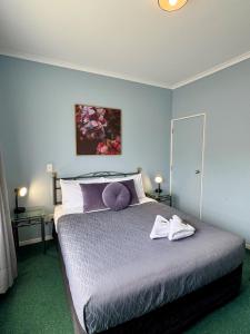 Postel nebo postele na pokoji v ubytování O'Reillys Motel