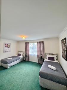 Postel nebo postele na pokoji v ubytování O'Reillys Motel